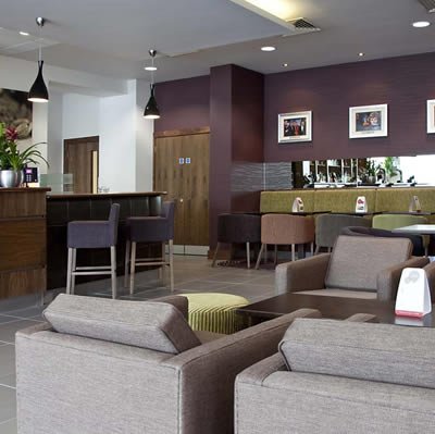 Hotel bar furnished in light brown colours