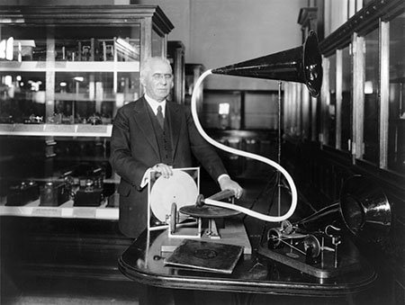Emile Berliner with a model of his first gramophone machine
