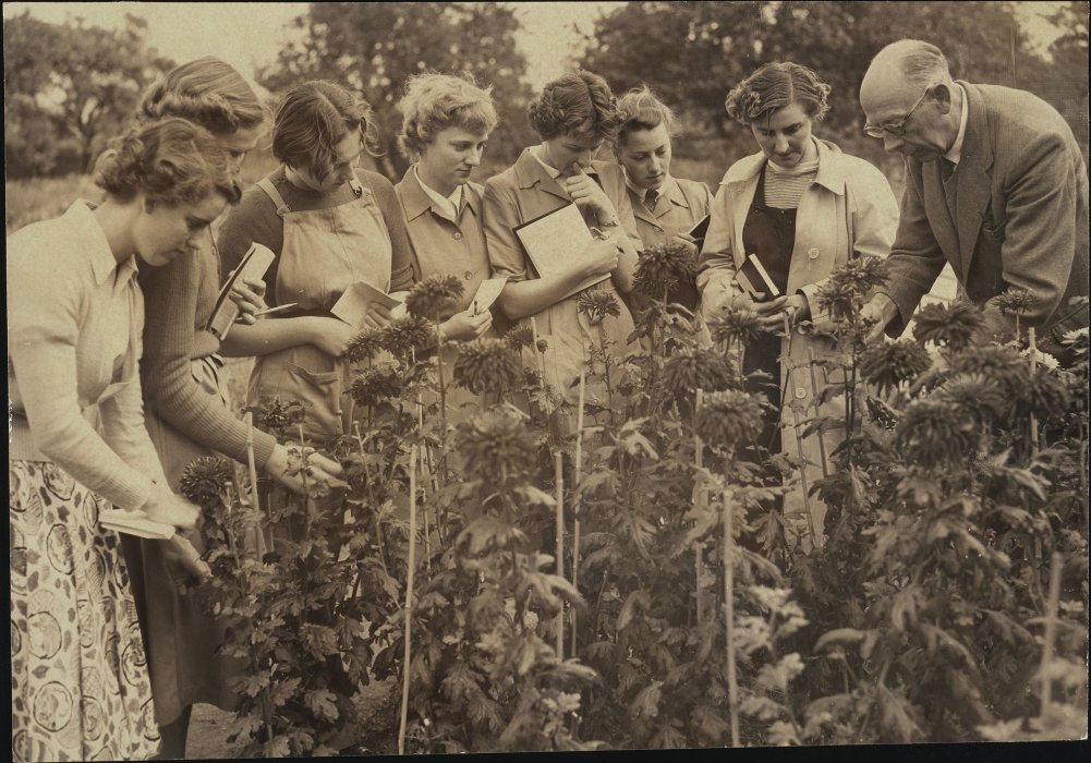 A group of women learn about horticulture from instructor Ted Birkin at the Agricultural Institute