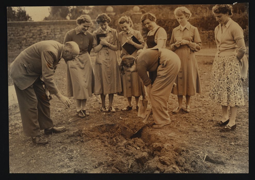 A group of women learn about horticulture from instructor Ted Birkin at the Agricultural Institute