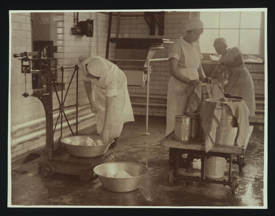 Female students making butter and cheese