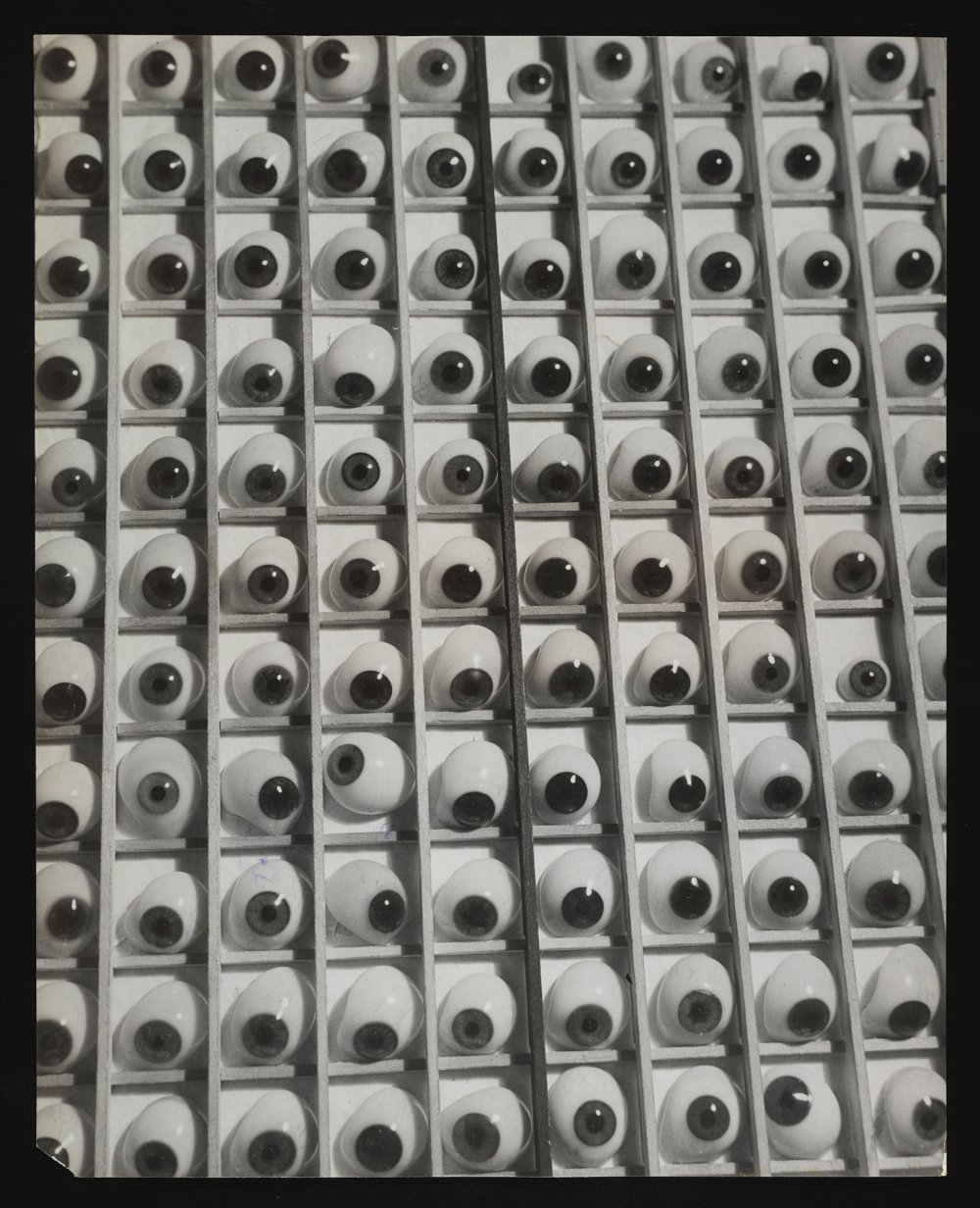 Rows of glass eyes in a box