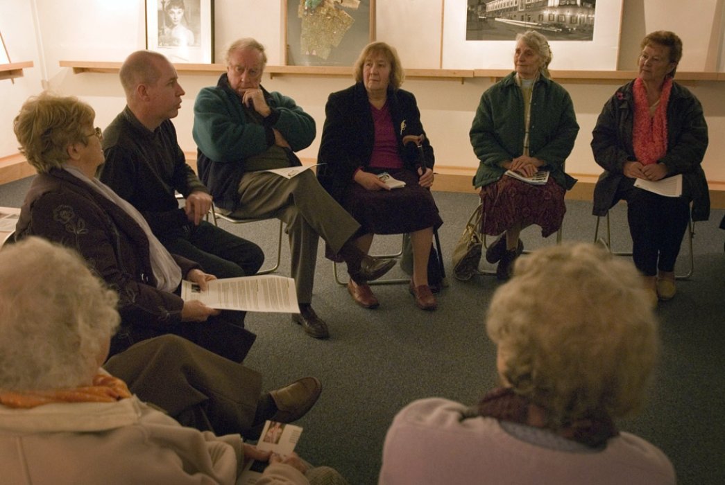 A volunteer leading a group discussion at one of our Reminiscence Sessions