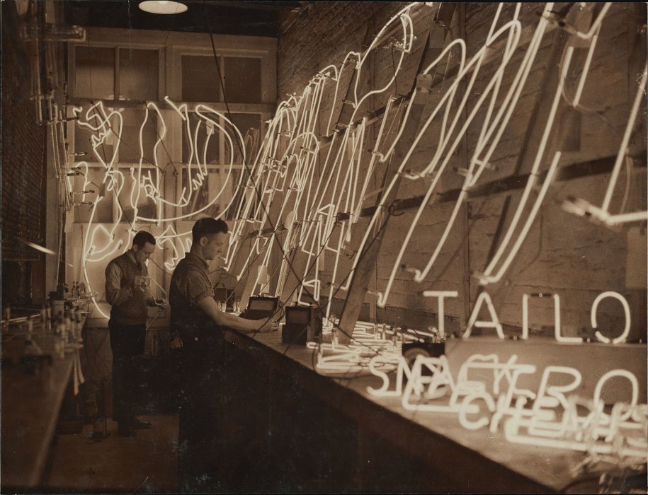 Men working on neon signs