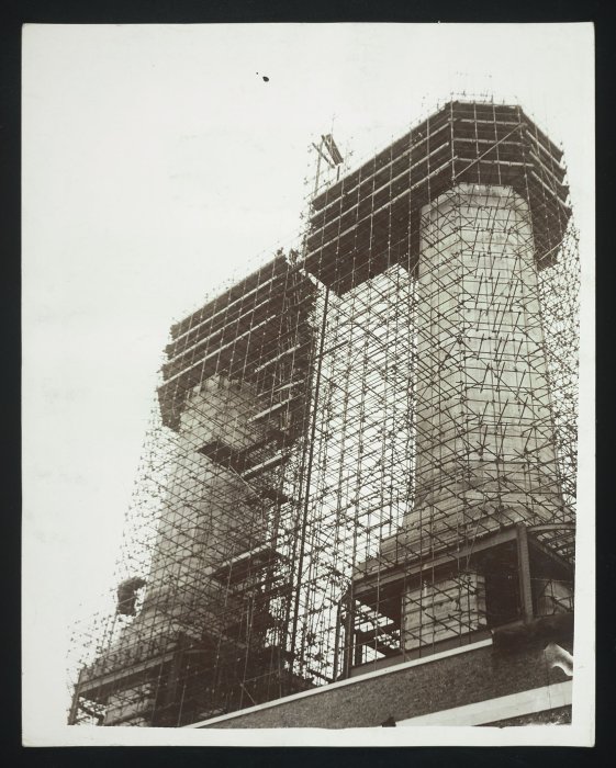 A system of scaffolding covers the two giant chimneys for the Fulham Power Station