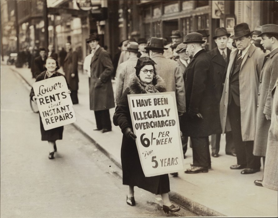 Women wearing placards parade outside Dominion Theatre
