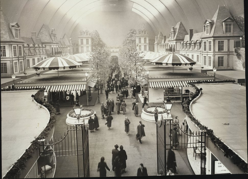General view of 1958 Ideal Home Exhibition with crowds exploring stands