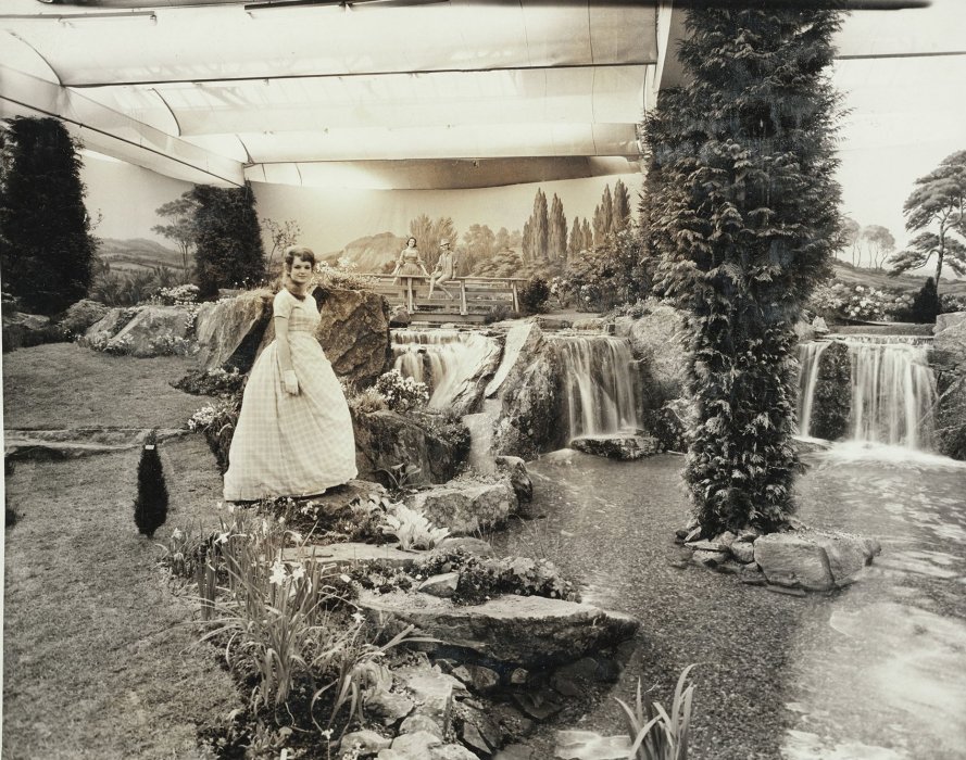 Model standing in demonstration garden at Ideal Home Show