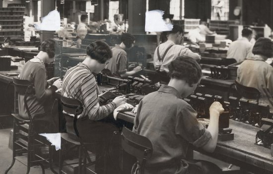 Row of workers in a camera factory