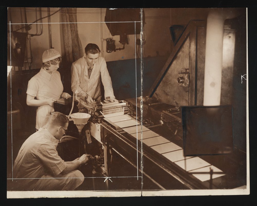 Factory workers using infrared lights to make photographic dry plates