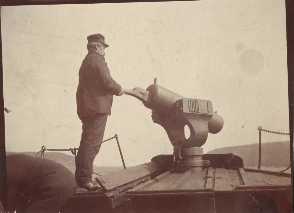 Whaling skipper with harpoon gun