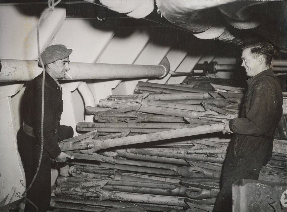 Harpoons being stowed in hold of ship