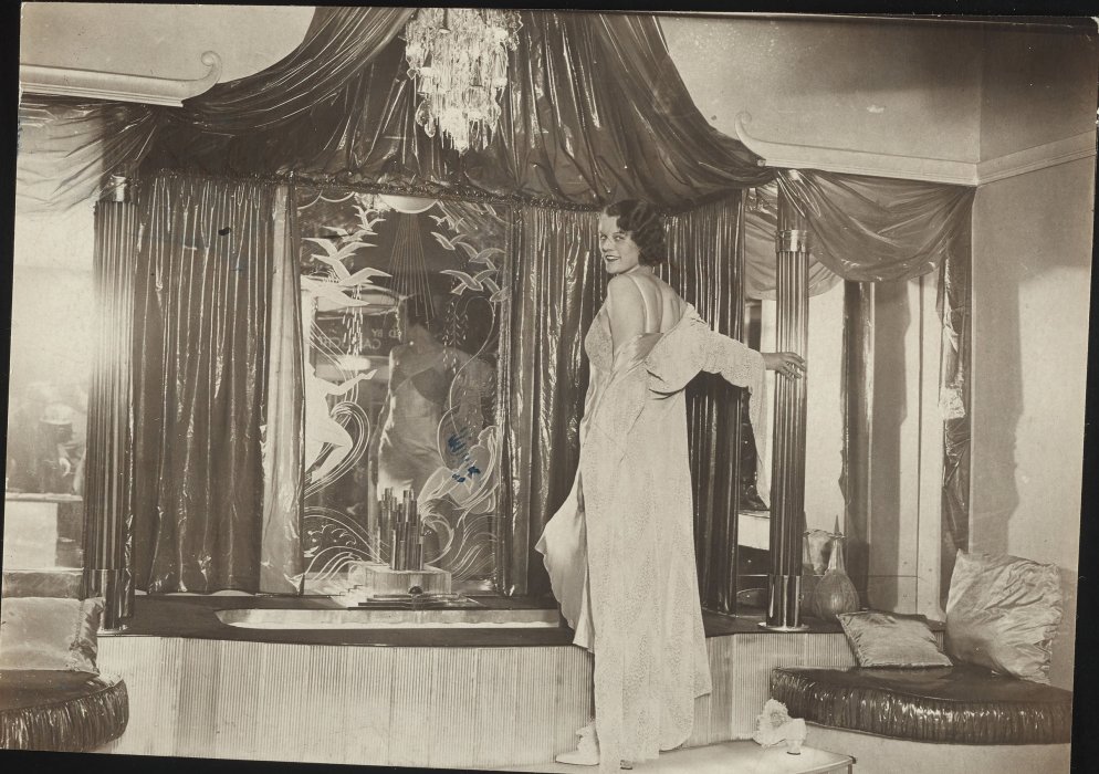 Model demonstrating modern marble bathroom with lighted shower, 1934