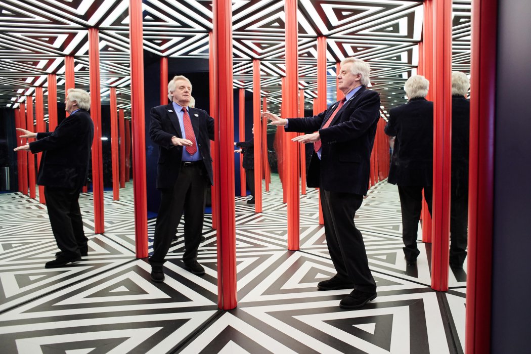 Lord Grade tests out the mirror maze in Wonderlab at the National Science and Media Museum, Bradford